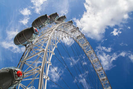 The big ferris wheel on background of sunny blue sky - London Eyeのeditorial素材