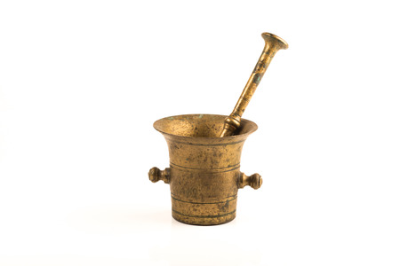 vintage brass grinder over a white backgroundの写真素材