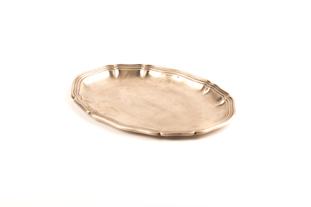 vintage round silver tray over a white backgroundの写真素材