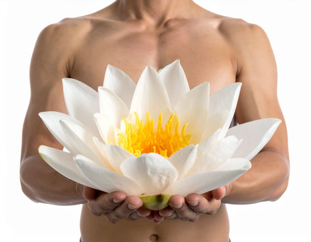 Beautiful white lotus flower in the hands of a naked manの素材
