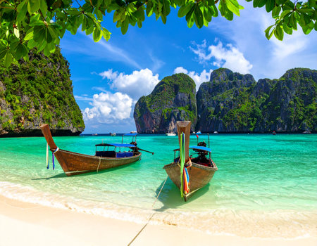 Tropical beach with traditional longtail boats, Phi Phi island, Thailandの素材