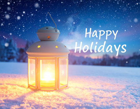 Happy Holidays greeting card with lantern in the snow. Festive background.の写真素材