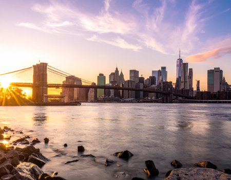 Manhattan skyline and Brooklyn Bridge at sunset, New York City.の写真素材