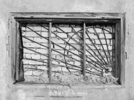 Abandoned old lattice window grungeの写真素材