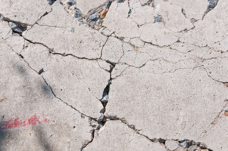 Cracked concrete wall texture.