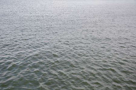 Ocean surface.Gloomy day.Waves ripple background.