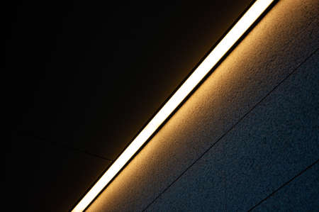 View of the narrow lamps in the corner of the ceiling.の写真素材