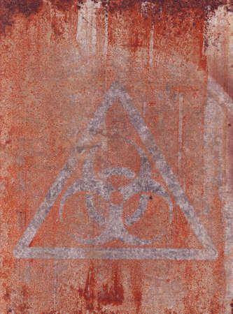 Biological hazard.Hazard symbol.Mark from an old sticker on a rusty metal surface.の写真素材