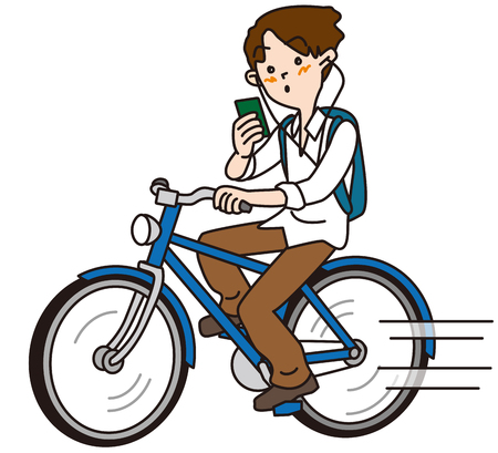 The person who rides a bicycle while callingの写真素材