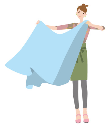 Woman hanging out the sheets  Laundryの写真素材