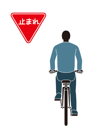 Man ride a Bicycle with Stop signの写真素材