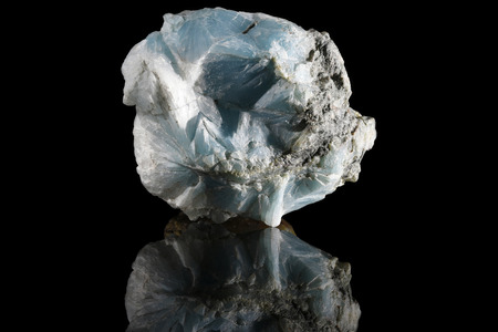 Sample of a beautiful natural raw Larimar specimen over black backgroundの写真素材