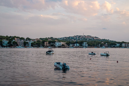 Boats in sunset on sea outside Santan Ponsa, Mallorcaの写真素材