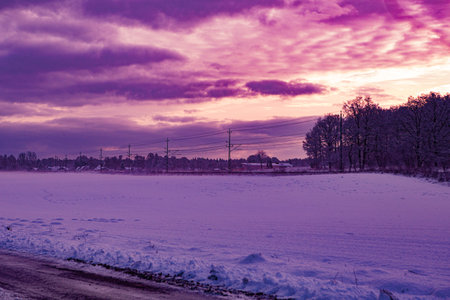 Sunset over winter landscape in Hassleholm, Swedenの写真素材