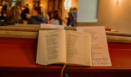 Hymn book in warm light church
