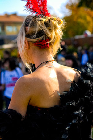 Girl with feather in blonde hair