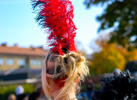 Red feather in blonde hairのeditorial素材