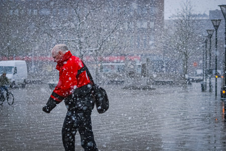 Man in snow fall on Varnhem, Malmo, Swedenのeditorial素材