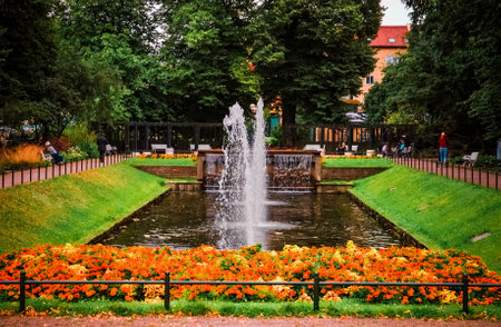 Fountain and flowers in Folkets park, the peoples park, in Malmo, Swedenのeditorial素材