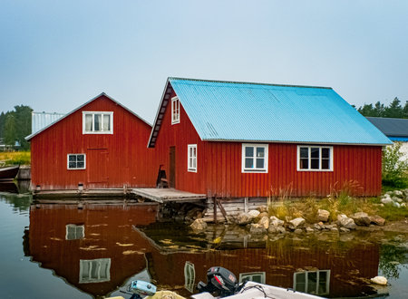 Traditional houses at Bottenviken sea in Norrfjarden, Nordmaling, Swedenの写真素材