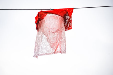 White and red shirt on clothesline