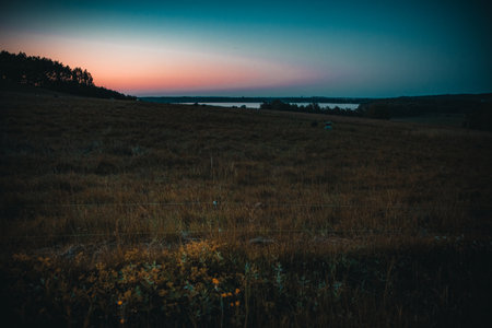 Sunset over lake seen from Hovdala Hills, Hassleholm, Sweden