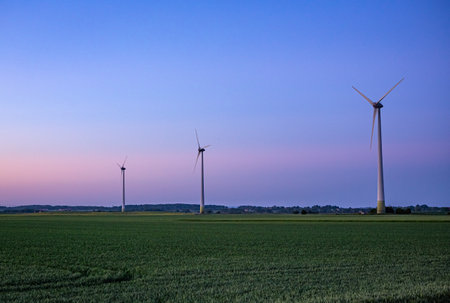 Windturbines in the sunset, on a field in south Sweden