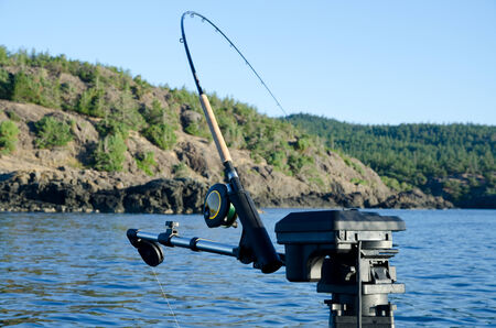 fishing rod with holder on boatの写真素材