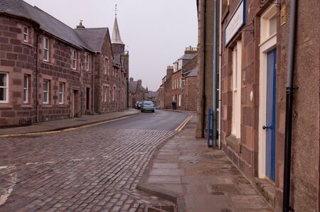 Cobble street and old buildings in Stone Haven Scotlandの写真素材
