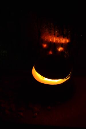 Halloween pumpkin in a glass reflectionの写真素材