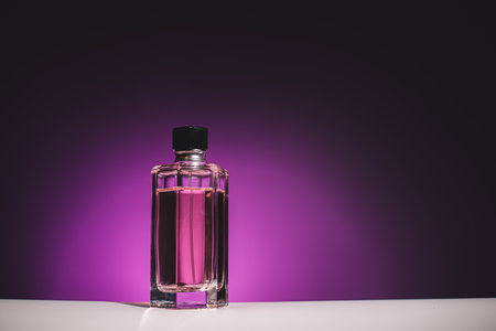 Bottle for perfume woman on lilac backgroundの写真素材