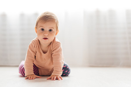 Little girl playing on floor, kindergarten, precocity