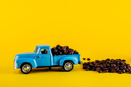 Coffee beans loaded into a toy machine. Delivery of coffee beans