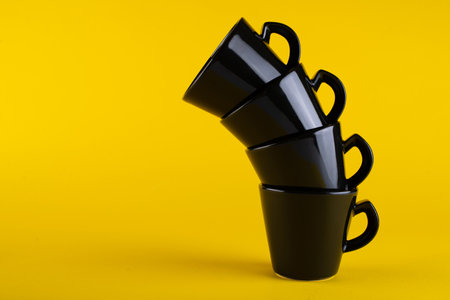A tower of black cups. Cup minimalismの写真素材