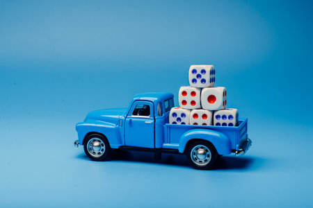 Toy car with dice on the pickupの写真素材