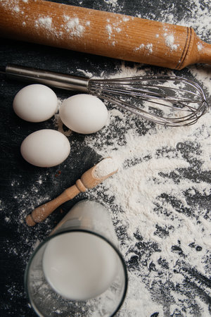 Bakery products -flour, eggs, milk. Selective focus, copy space.