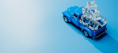 The car is loaded with ice cubes. Toy car minimalismの写真素材