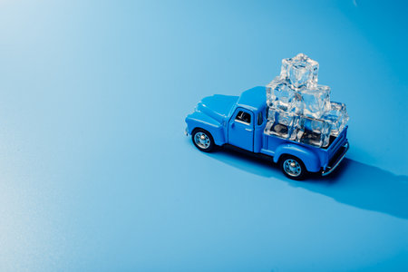 Toy car with ice. Ice for cocktailsの写真素材