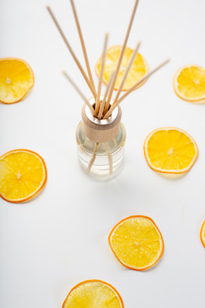 Aroma sticks in glass bottle. Wooden aroma sticks in a glass flaskの写真素材