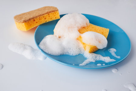 Cleaning set for different surfaces in kitchen, bathroom and other rooms. Empty place for text or...