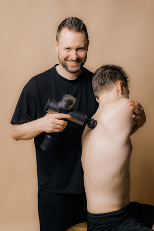 image of physiotherapist massaging man in hospitalの写真素材