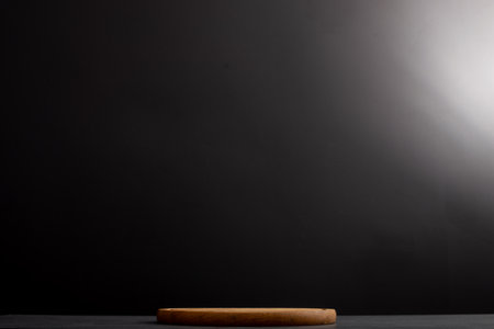Black background with wooden pizza board