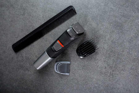 Wireless hair trimmer and beard on gray stone backgroundの写真素材