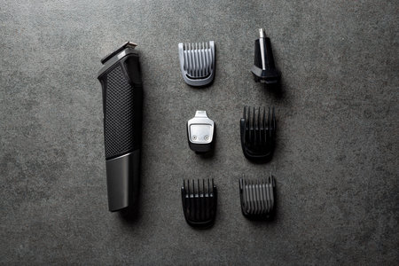 modern electric comfortable stylish powerful electrical plastic beautiful gray hair clipper lies