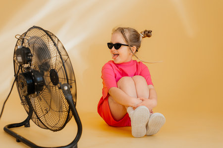 Cute girl 4-5 year old posing in studioの写真素材