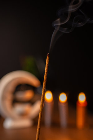 Burning aromatic incense smoky stick for meditation and relaxing. Aromatherapy smoke for yoga concept.の写真素材