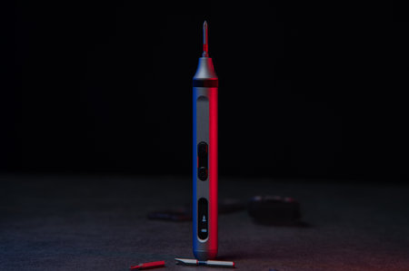 Electric mini screwdriver and several different interchangeable bits.