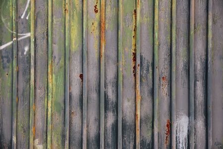 Background gate sheet stained with green paint blue and grayの写真素材