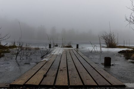 A misty day by the lakeの写真素材