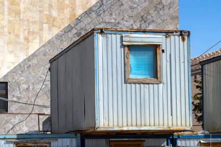 A container-shaped room for seasonal workers at a construction site. It stands on the same containers.の写真素材